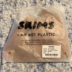 Skims mid waist thong. Color is sienna